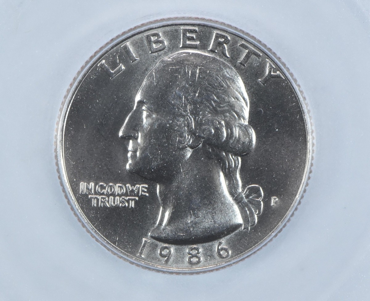 1986 quarter MS-67 gem example compared to typical circulated 1986-P quarter with contact marks